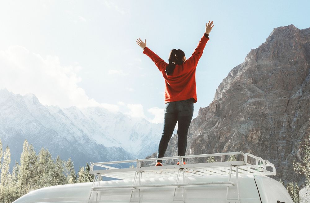 Adventure desktop wallpaper background, woman standing on a van, white tone