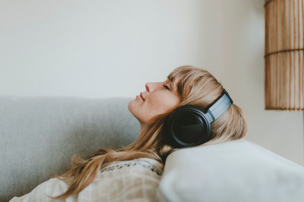 Woman listening to music, white tone