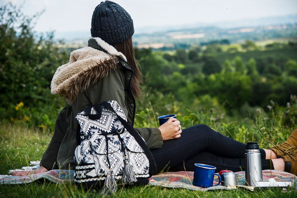 Woman picnic in nature, vivid tone