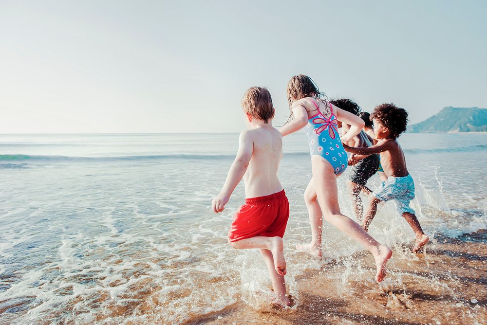 Kids at the beach summer vacation, vivid tone