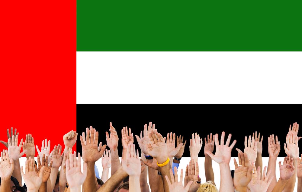 UAE National Flag People Hand Raised Concept