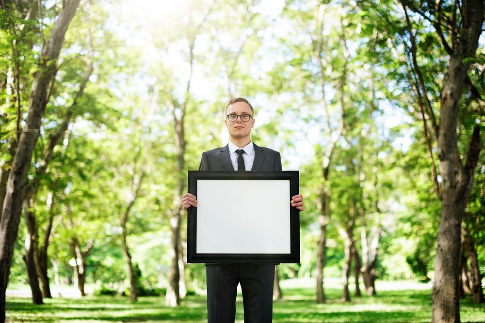 Businessman Holding Picture Frame Copy Space Concept