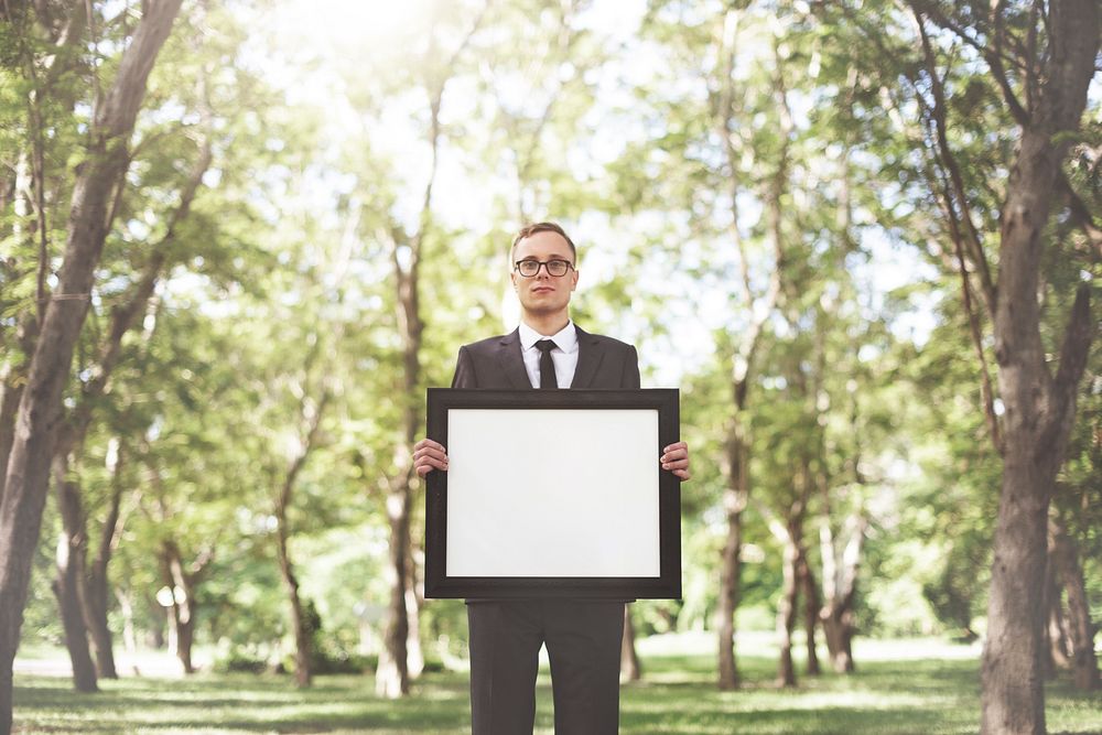 Businessman Holding Picture Frame Copy Space Concept