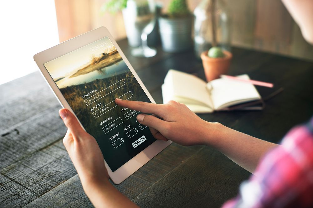 Tablet Searching Flight Travel Booking Concept