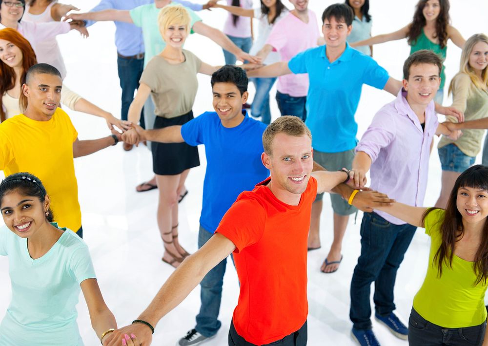 Large group of young multi-ethnic people connecting with each other