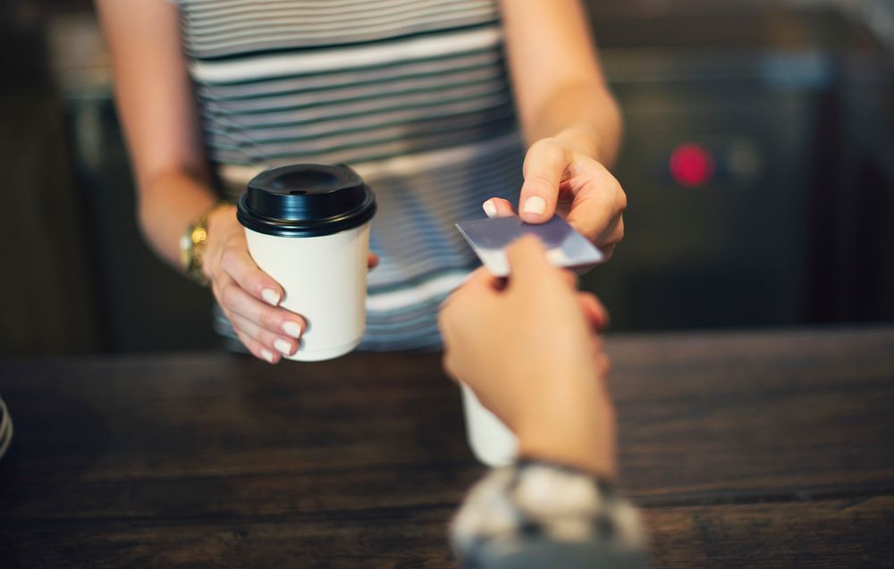Customer paying coffee with credit card