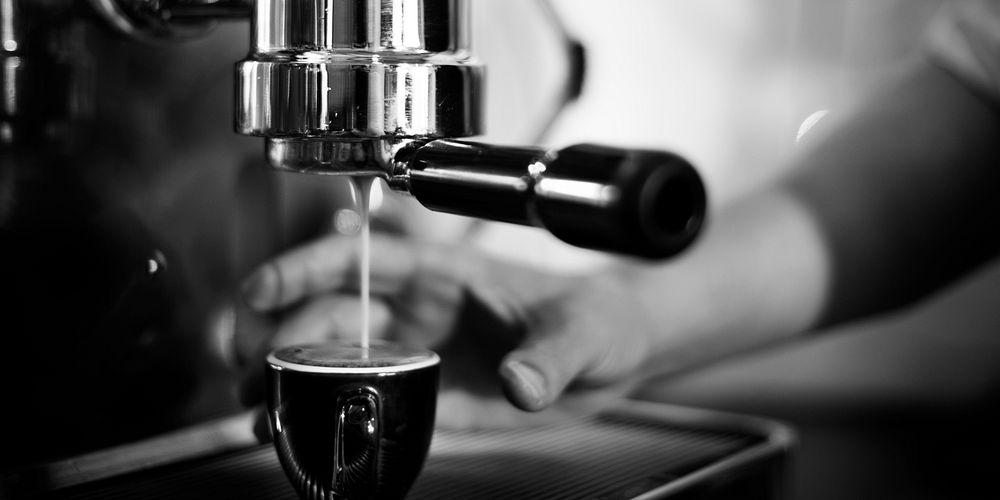 Coffee maker machine making espresso shot