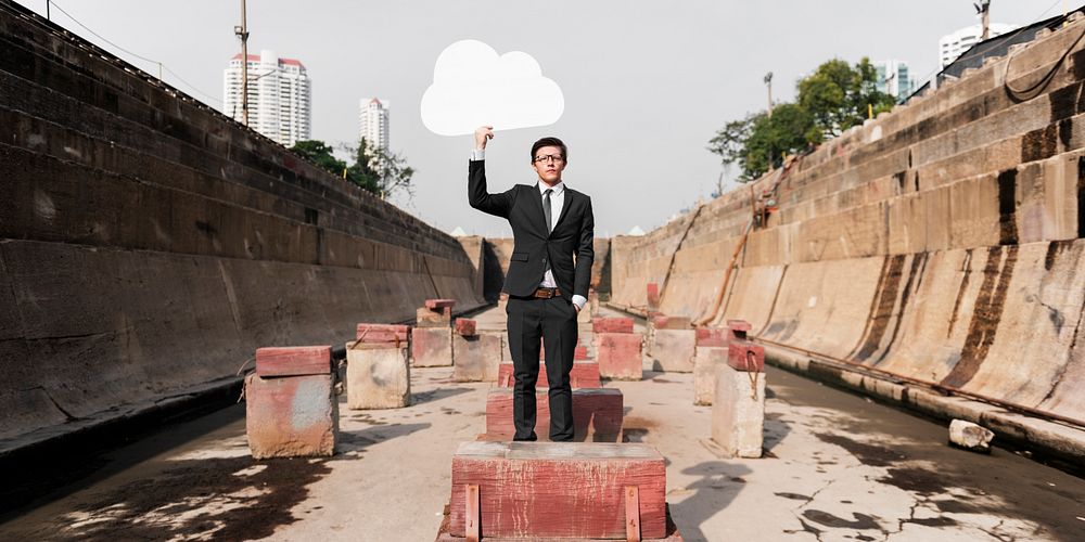 Businessman Holding Cloud Network Symbol Concept