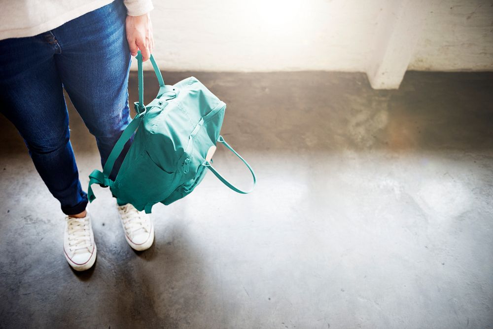 Asian woman carrying a backpack