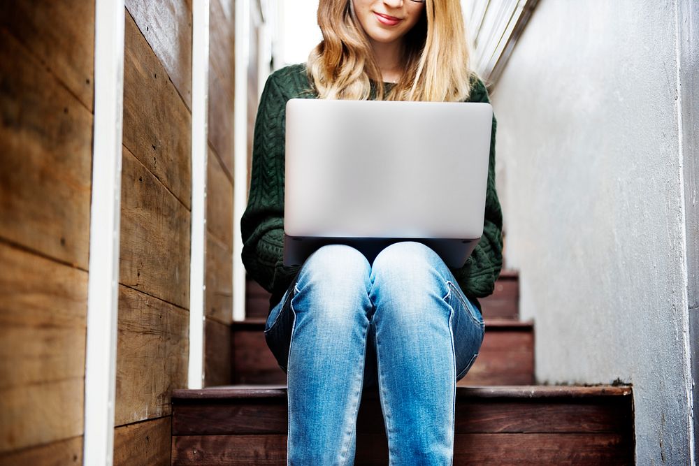Young woman is using computer laptop