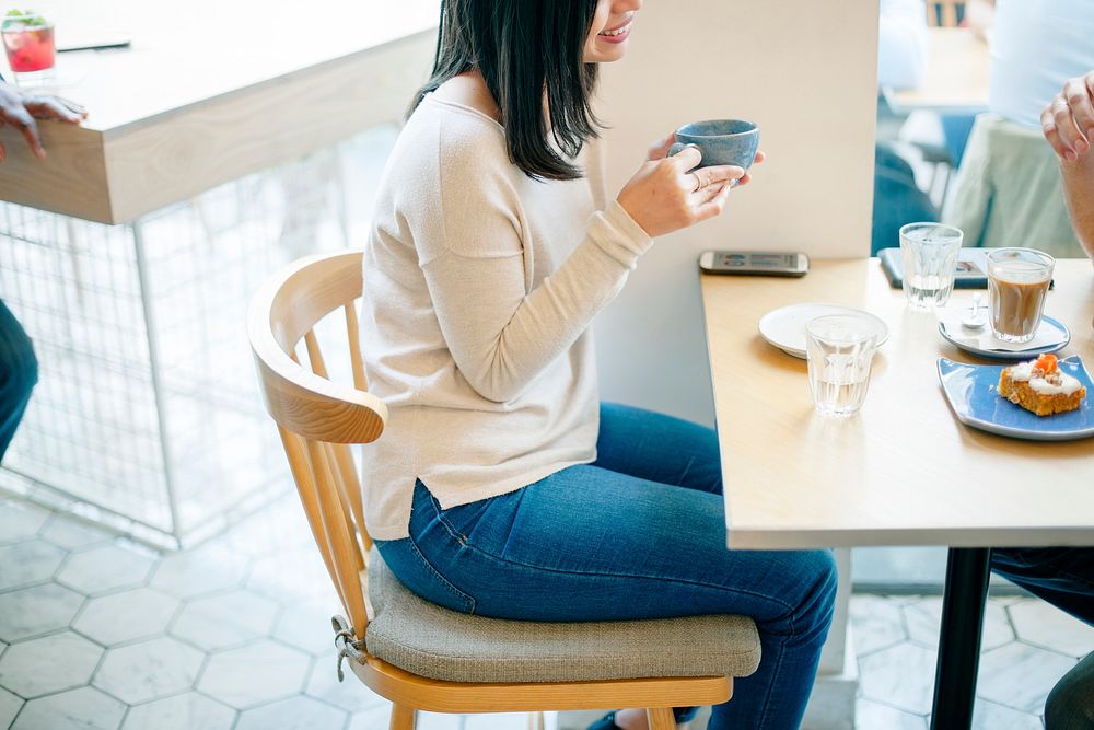 Asian woman sitting in coffee cafe