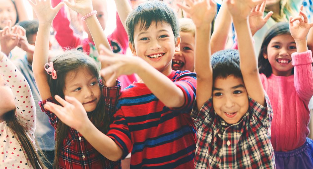 Happy diverse young school kids