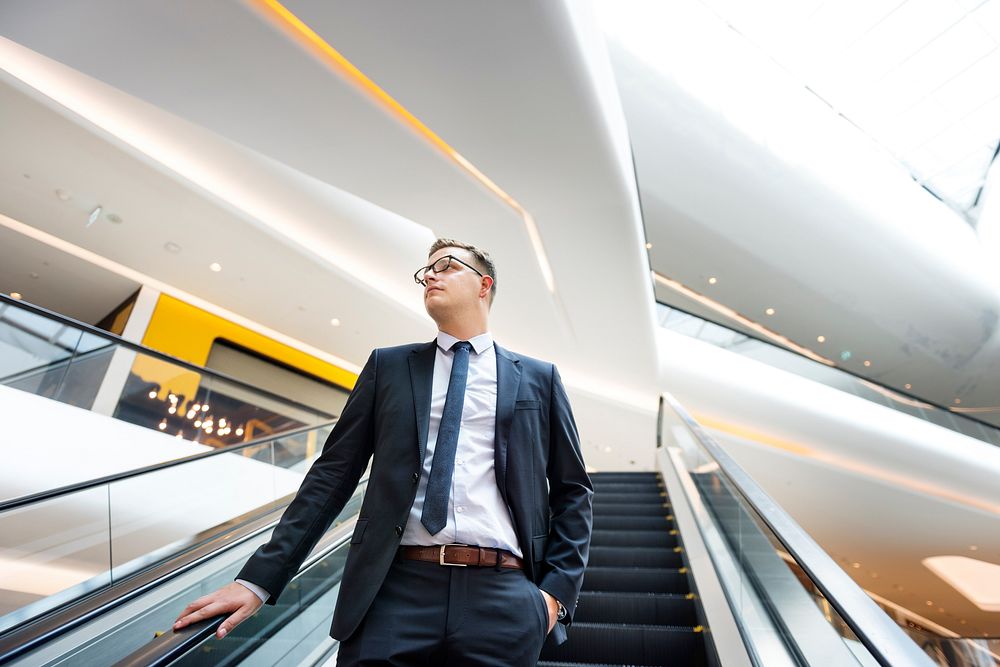 Business Man Looking Escalator Thinking Concept