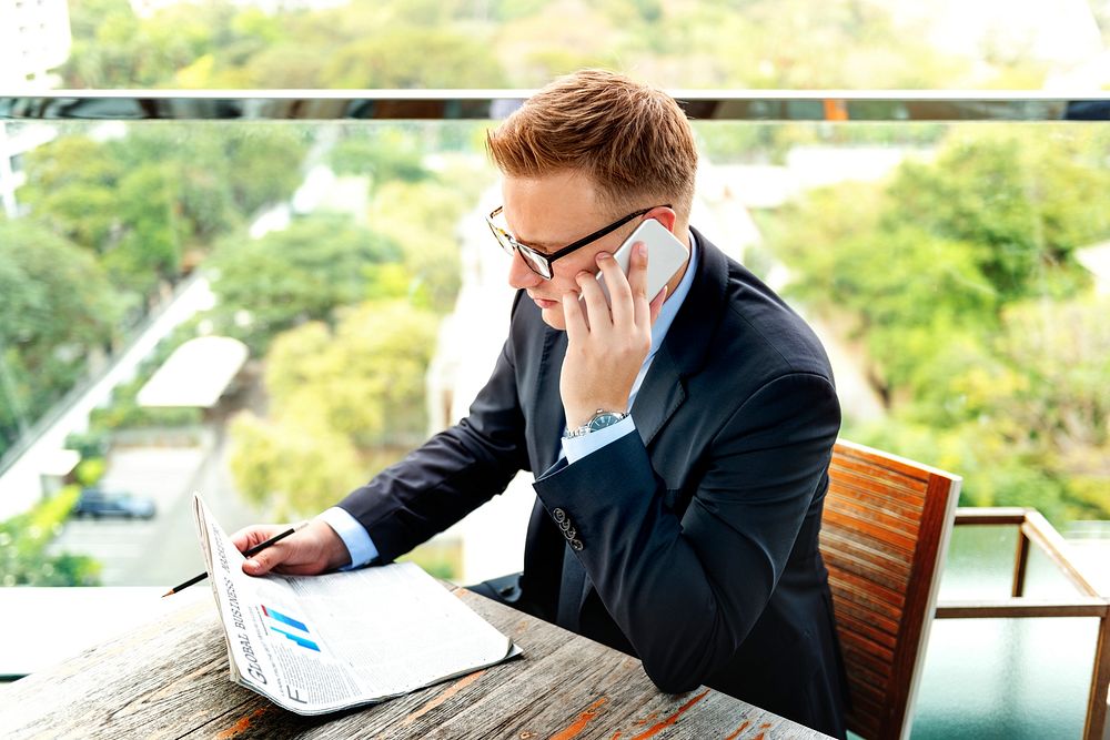 Businessman Reading Global Business Report Concept