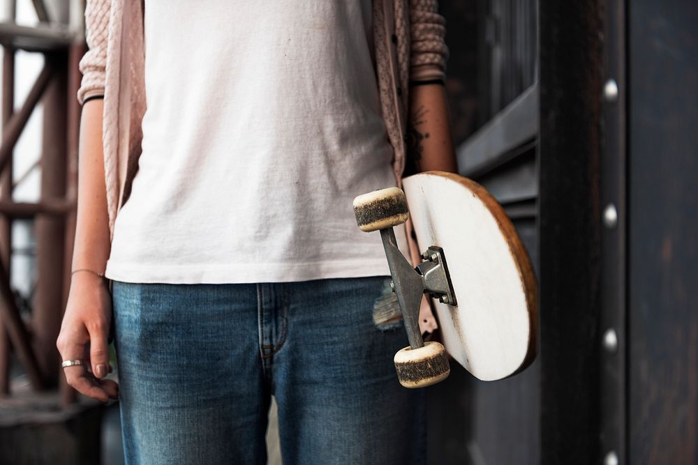 Hand holding skateboard