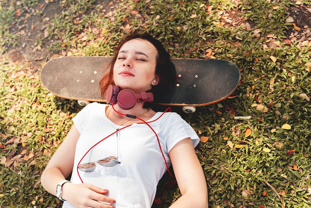 Woman Lying In The Park Relaxation Concept