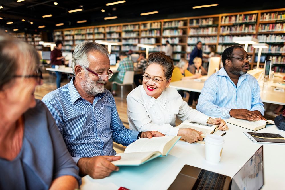 Seniors studying together at the library