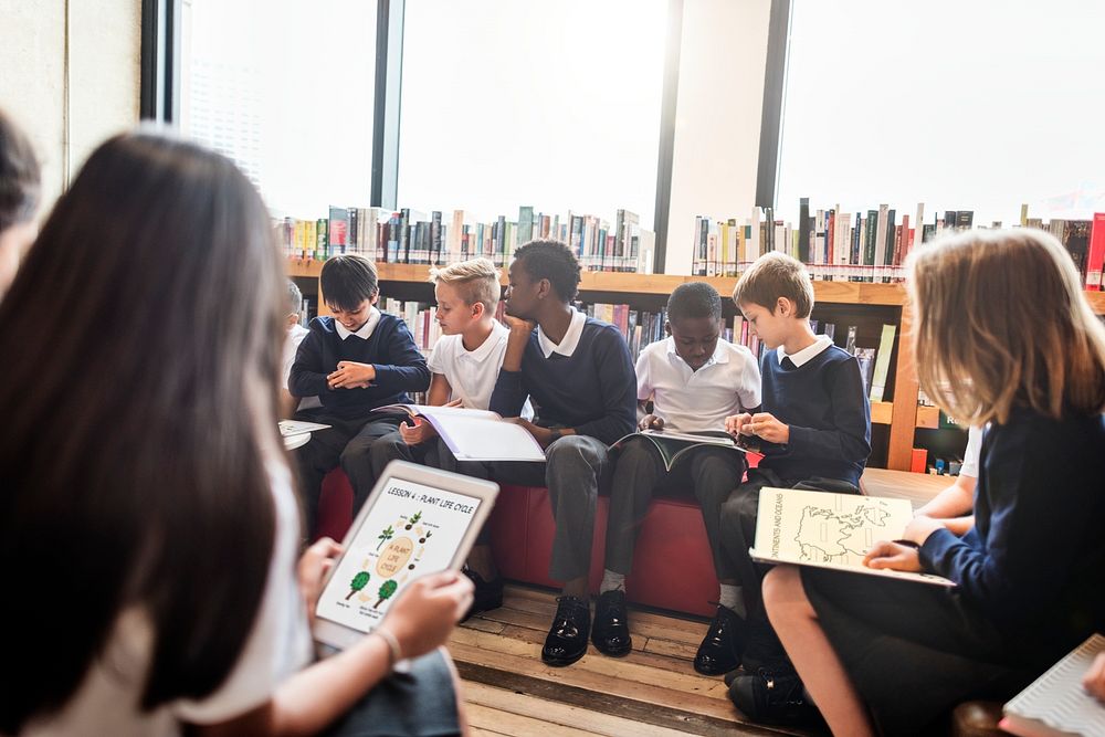 Students learning online through digital tablets