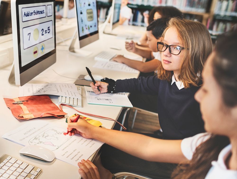 Young students using computers in class