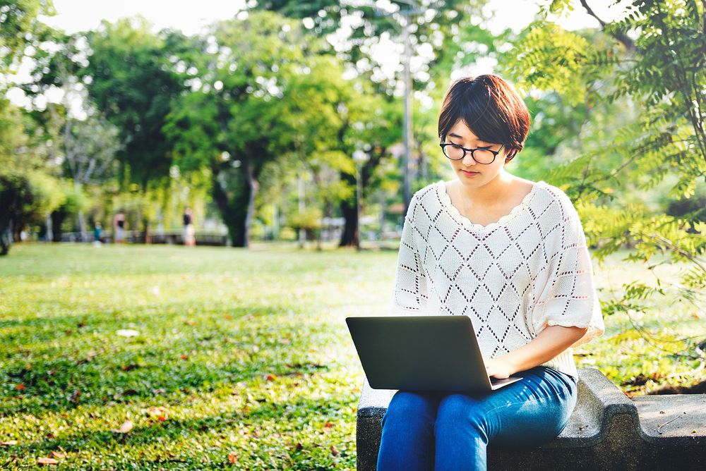 Woman Using Tablet Environmental Park Relaxation Concept