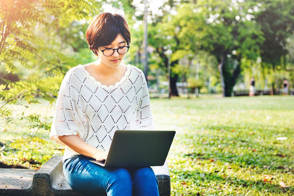 Woman Using Tablet Environmental Park Relaxation Concept