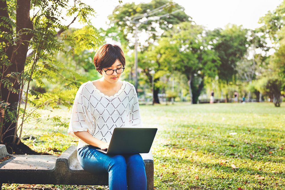 Woman Using Tablet Environmental Park Relaxation Concept