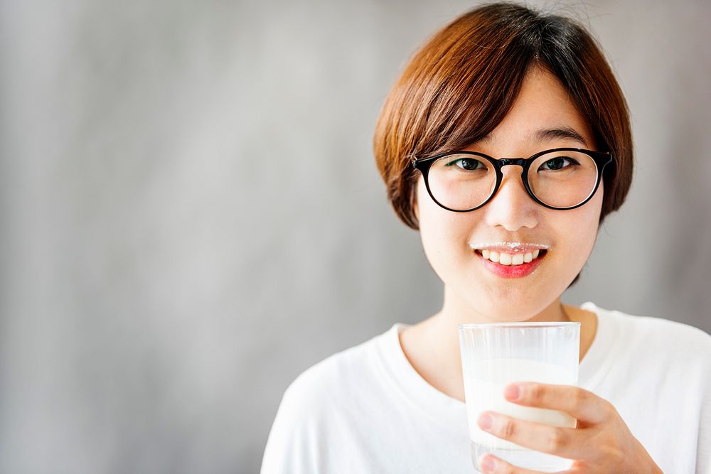 Asian Girl Drinking Milk Beverage Grow Up Relaxation Concept