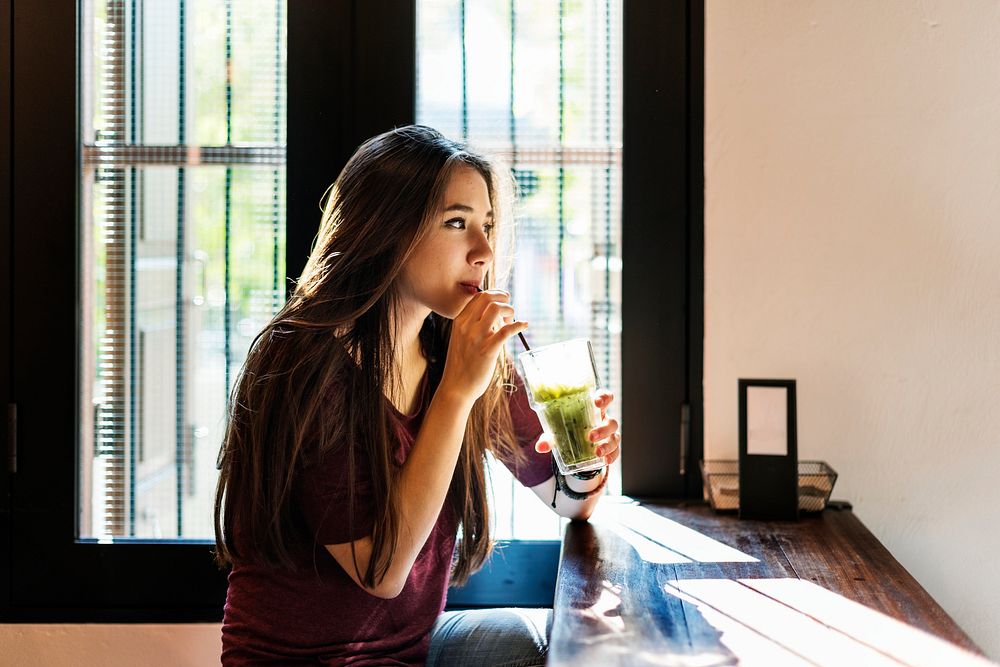 Woman sipping green tea