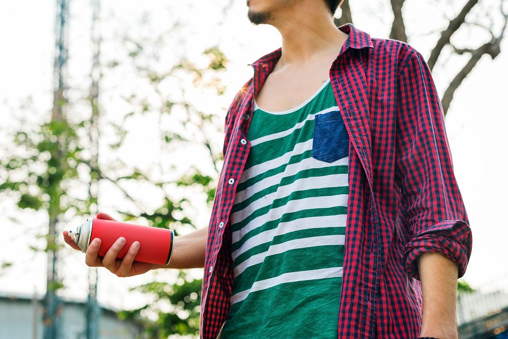 Man holding paint spray can