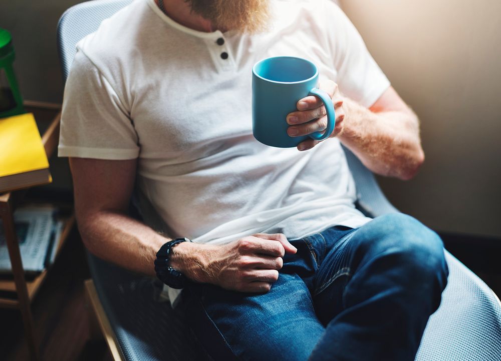 Bearded man with a coffee cup