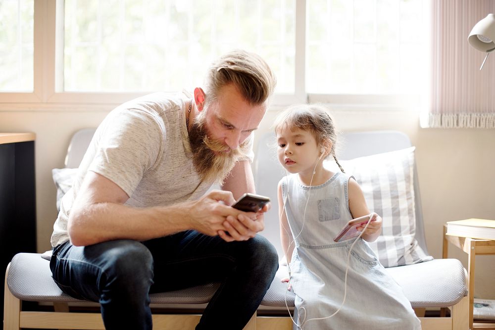 Father Daughter Using Devices Concept
