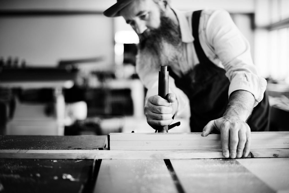 Carpenter working in workshop grayscale