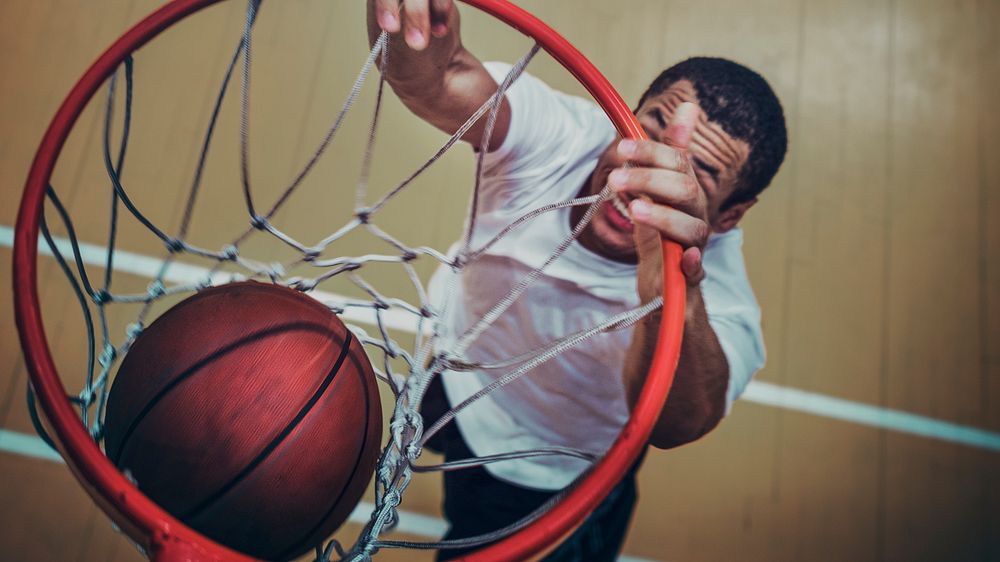 Basketball player making a slam dunk wallpaper