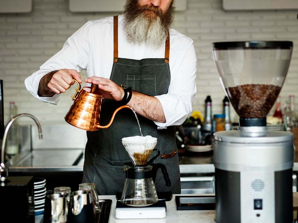 Caucasian barista man making drip coffee