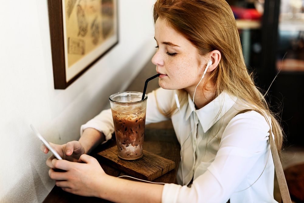 Young caucasian woman at a coffee shop