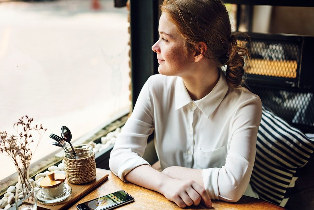 Young caucasian woman at a coffee shop