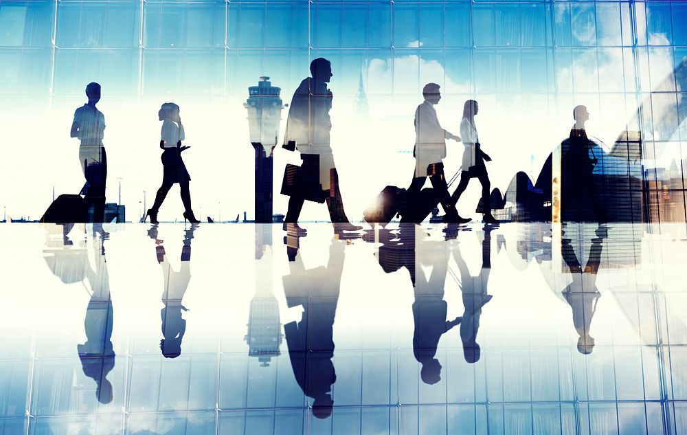 Group of Business Travellers Walking in the Airport