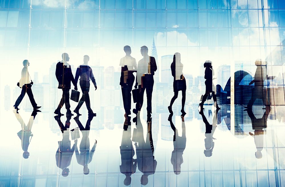 Silhouettes of Business People Walking inside the Office