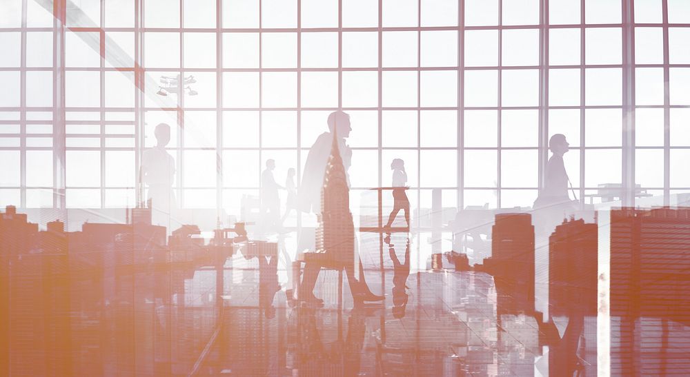 Silhouettes of Business People Walking Inside the Office