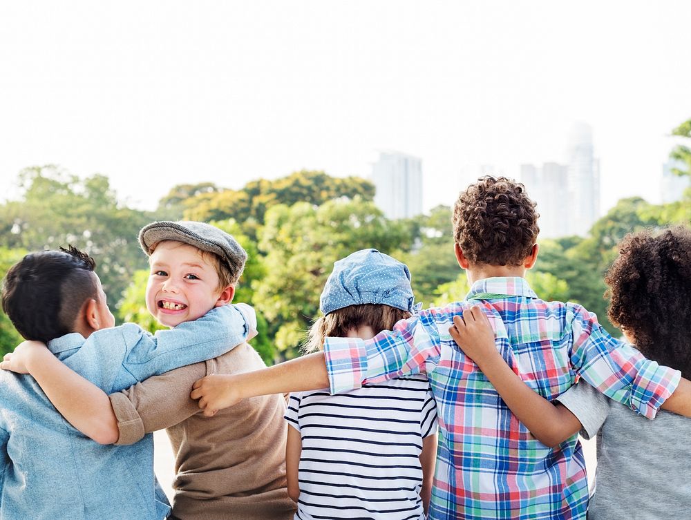 Group of diverse kids back turned arms around together