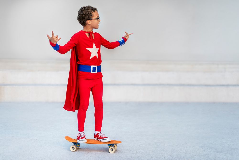 Superman Kid Playing Skateboard Cheerful Concept