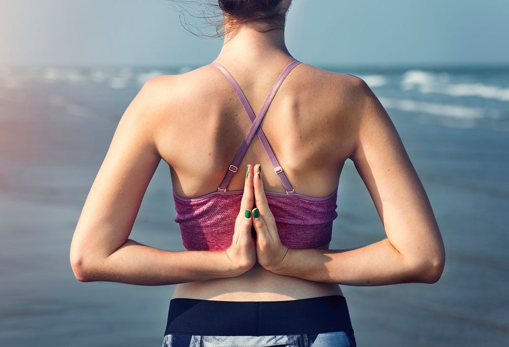 Female Meditating Yoga Pose Beach Concept