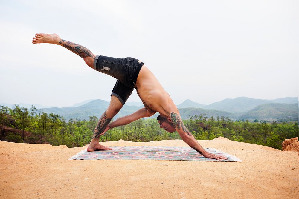 Tattooed Man Yoga Outdoors Concept