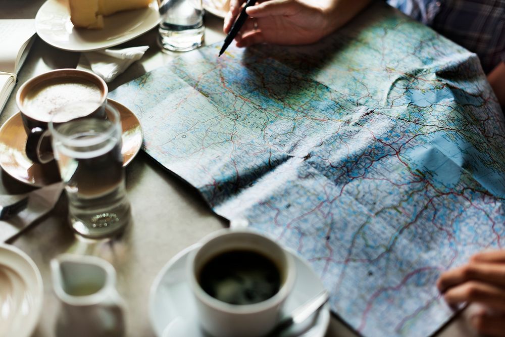 Person Choosing Destination On Map Concept