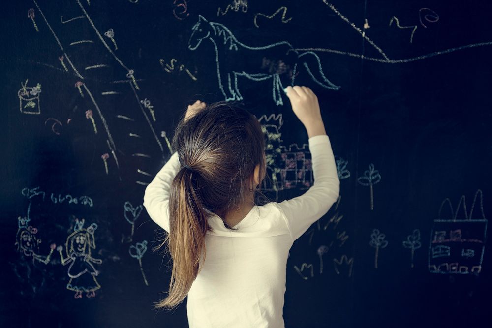 Girl Drawing Blackboard Chalk Concept