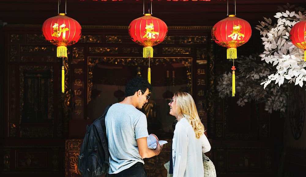 Caucasian tourist couple in chinese joss house