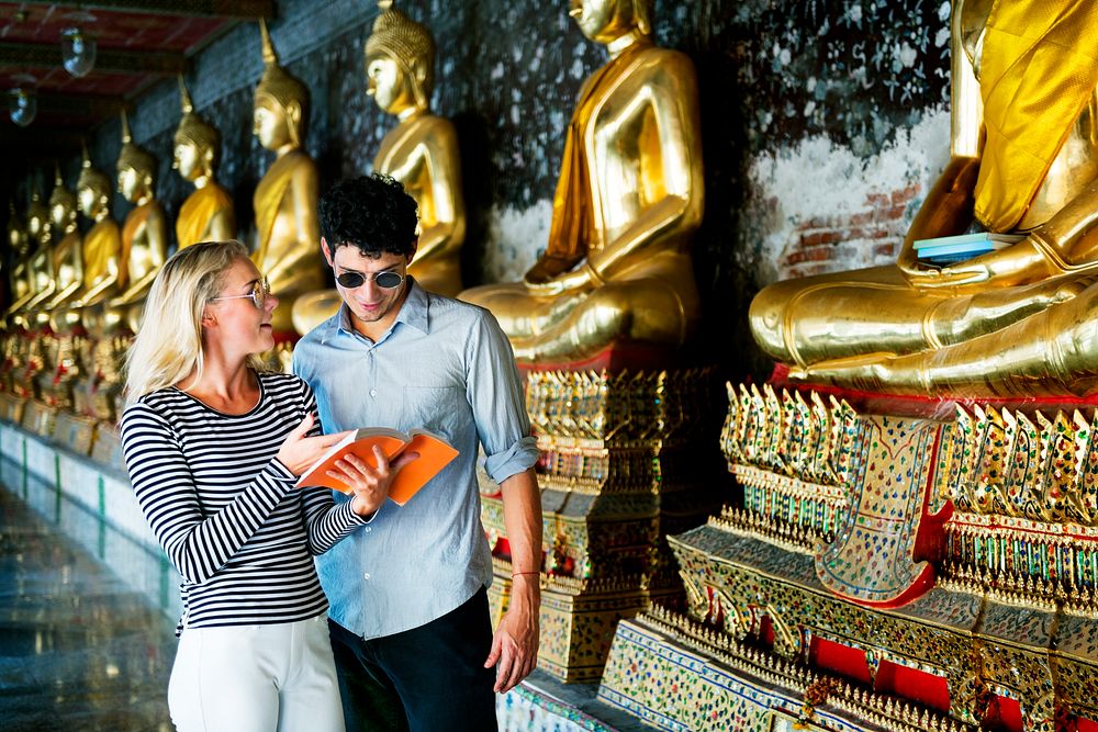 Caucasian couple is touring at the temple