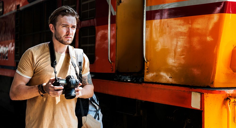 Caucasian photographer at the train station