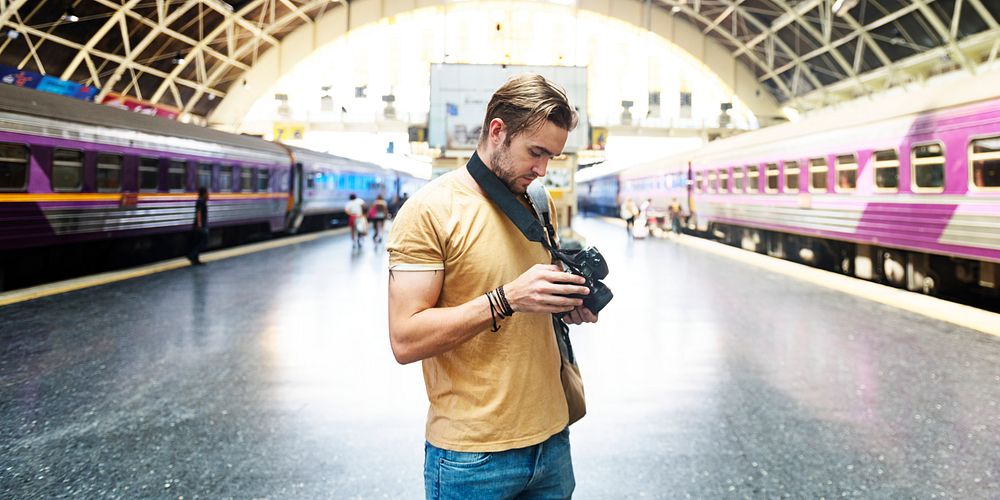 Caucasian photographer at the train station