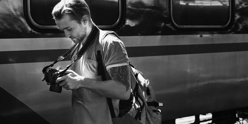 Caucasian photographer at the train station